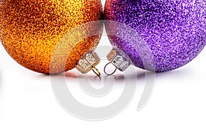 Multi colored christmas balls on white background.