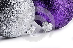 Multi colored christmas balls on white background.