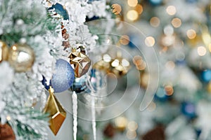 Multi-colored Christmas toys close-up on a background of bokeh lights. Close-upplace for text