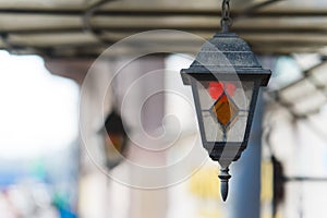 Multi colored classic hanging street lamp. outside