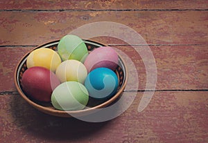 Multi-colored Easter eggs in a bowl