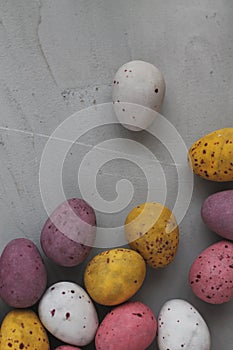 Multi-colored Easter eggs. Easter wallpaper. easter eggs on gray background