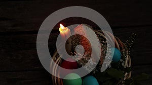 Multi-colored easter eggs lie on an old wooden board, on quarantine on Easter day