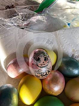 Multi-Colored Easter Eggs in a Paper Towel Lined Bowl