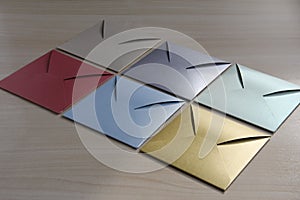 Multi-colored envelopes on the light table