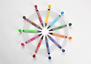 Multi colored felt tip pens on white background