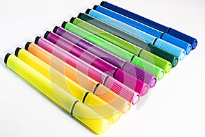 Multi-colored felt-tip pens on a white background. Tools for drawing and creativity. Bright colors. School supplies. opy space