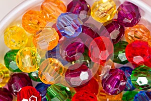 Multi-colored glass beads for beads and bracelets shot large on a white background