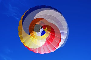 Multi colored hot air balloon on a blue sky 2