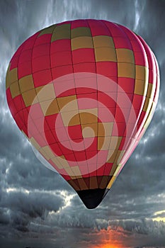 Multi colored hot air balloon fly in the blue sky