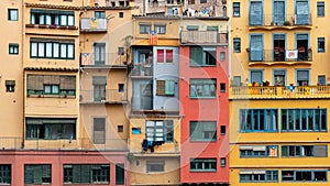 Multi colored houses on the bank of the Onyar River, Girona, Spain