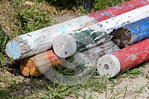 Multi colored image of show jumping poles at the show jumping arena. Wooden barriers for jumping horses as a background