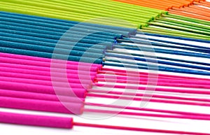 Multi-colored incense isolated on white background