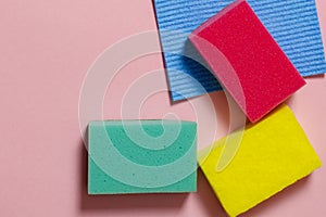 Multi-colored inoperes for cleaning the house on a colored background with a place for text