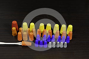 Multi-colored insulators for bare wire ends