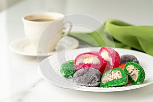 Multi-colored Japanese cakes Mochi in a white plate