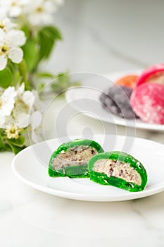 Multi-colored Japanese cakes Mochi in a white plate