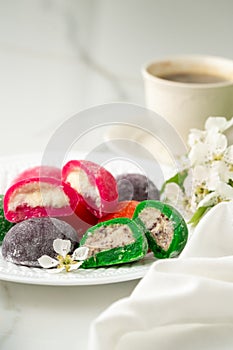 Multi-colored Japanese cakes Mochi in a white plate