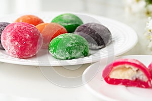 Multi-colored Japanese cakes Mochi in a white plate