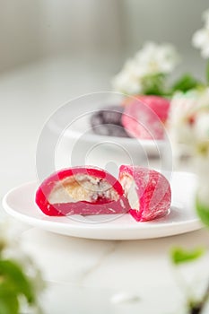 Multi-colored Japanese cakes Mochi in a white plate