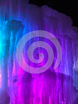 Multi-colored lighted icicle walls in ice castle
