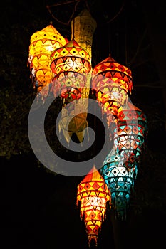 Multi-colored lights adorn the night beach of Ao Nang. Traditional Thai motifs