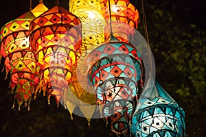 Multi-colored lights adorn the night beach of Ao Nang. Traditional Thai motifs