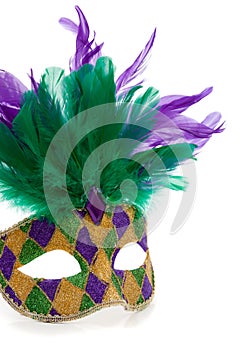 A Multi-colored Mardi gras mask on a white background