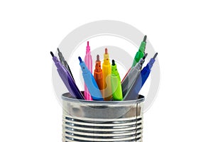 Multi-colored markers in a tin isolated on a white background.