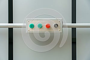 Multi-colored mechanical buttons and a keyhole for turning on the mechanism. A dashboard with buttons for controlling the drive of