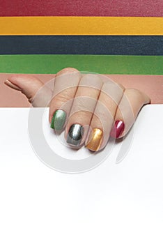 Multi-colored mother of pearl manicure on short nails.Nail art. photo