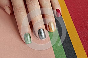 Multi-colored mother of pearl manicure on short nails.Nail art. photo