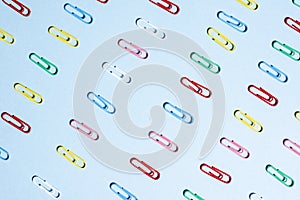 Multi-colored paper clips in row