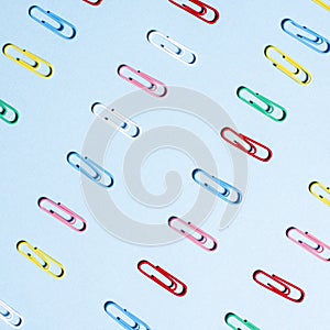 Multi-colored paper clips in row