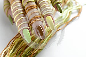 Multi-colored pastel manicure on a long oval shape