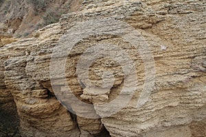 Multi-colored piece of rock by the sea