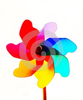 Multi colored pinwheel against white background.