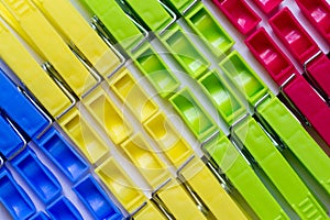 Multi-colored plastic clothespins close-up.