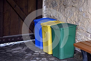 Multi-colored plastic containers for separate garbage collection. The concept of environmental protection from pollution.