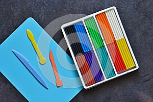 Multi-colored plasticine and modeling board. View from above