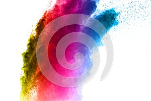 Multi colored powder explosion on white background.