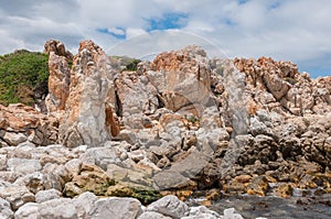 Multi-colored rocks at the harbor in Kleinmond photo