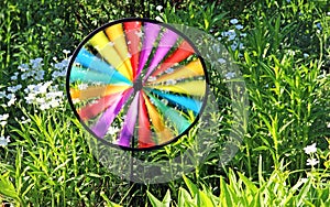 Multi colored round pinwheel in motion
