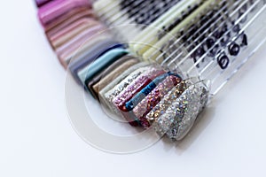 Multi-colored samples of nail tips for nail design. Manicure nail polish samples in different colors