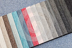 Multi-colored samples of upholstery fabric for sofas and chairs close-up