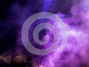 Multi-colored smoke at the concert at night