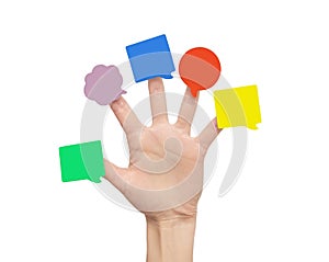 Multi-colored stickers on fingers of the hand.