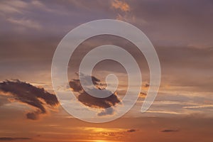 multi-colored sunset with different colors and clouds as the sun