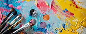 A multi-colored table with makeup products and brushes arranged in an artistic manner. The vibrant