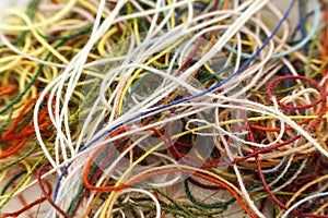 Multi-colored tangled colorful needlecraft silk thread rope. Mac